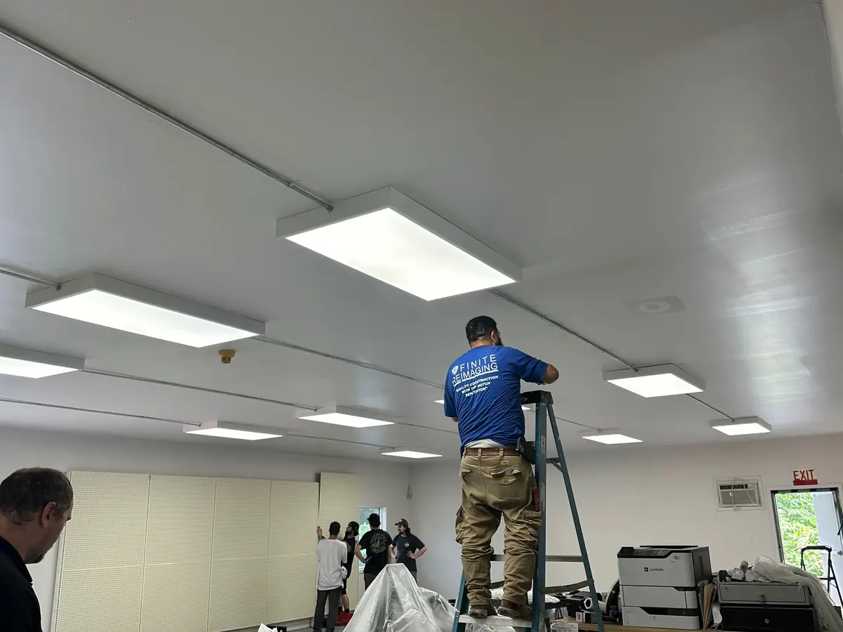 Commercial LED ceiling panel retrofit in a Long Island retail store — bright, even lighting installed without business downtime by Berman Electric.