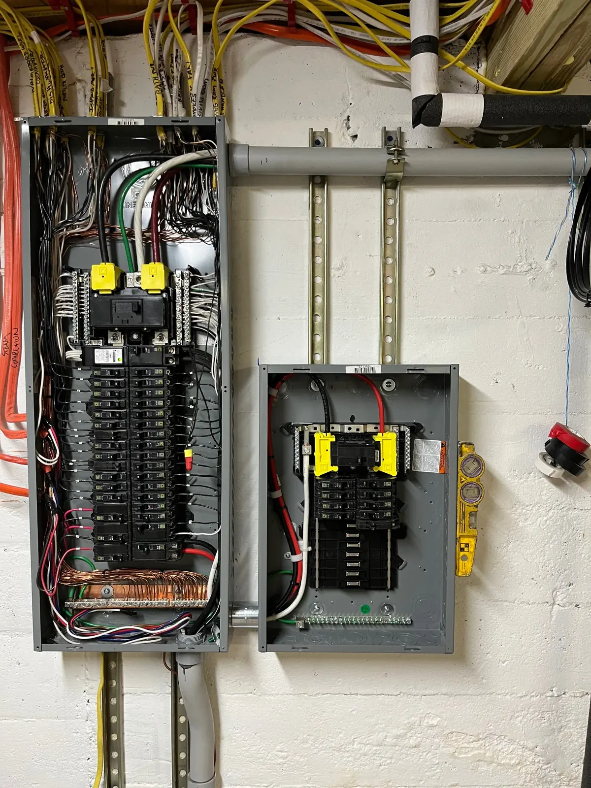Completed 200-amp electrical panel upgrade in a Hauppauge NY home — clearly labeled breakers and neat conductor routing by Berman Electric.